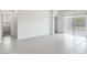 Bright living space with tile floors, backyard access, and neutral paint at 10619 W Sonrisas St, Tolleson, AZ 85353