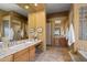 Well lit primary bathroom featuring dual sinks, tiled countertops and a walk in shower at 10886 E Ludlow Dr, Scottsdale, AZ 85255