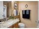 Bathroom features granite counters, decorative faucets, and a shower with glass door at 10886 E Ludlow Dr, Scottsdale, AZ 85255