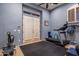 Exercise room featuring a treadmill, rowing machine, and rubber flooring at 10886 E Ludlow Dr, Scottsdale, AZ 85255