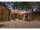 Inviting home features lush bougainvillea, desert landscaping and a tranquil water feature at 10886 E Ludlow Dr, Scottsdale, AZ 85255