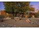 Beautiful home with desert landscaping, mature trees and an inviting circular drive at 10886 E Ludlow Dr, Scottsdale, AZ 85255