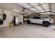 Spacious garage featuring a clean painted floor and equipped to hold a large truck plus storage on the wall at 10886 E Ludlow Dr, Scottsdale, AZ 85255