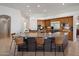 Kitchen features a large island, wooden cabinets, and bar stool seating at 10886 E Ludlow Dr, Scottsdale, AZ 85255
