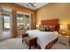 Comfortable bedroom with large windows and outside access to enjoy the desert views at 10886 E Ludlow Dr, Scottsdale, AZ 85255