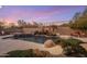 Resort-style pool with waterfall features, mature trees and landscaping at 10886 E Ludlow Dr, Scottsdale, AZ 85255