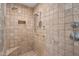 Walk in shower featuring dual shower heads and a built in bench at 10886 E Ludlow Dr, Scottsdale, AZ 85255