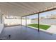 Large covered back patio overlooking a yard with low-maintenance landscaping at 12207 N Escobar Way, Phoenix, AZ 85022