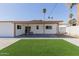 Backyard featuring low-maintenance landscaping and covered patio at 12207 N Escobar Way, Phoenix, AZ 85022
