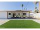 Beautiful backyard featuring covered patio, lush lawn, and well-maintained landscaping for outdoor enjoyment at 12207 N Escobar Way, Phoenix, AZ 85022