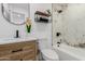 Stylish bathroom with a tub and shower, decorative tile, and a modern vanity with sleek fixtures at 12207 N Escobar Way, Phoenix, AZ 85022