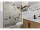 Elegant bathroom featuring stylish vanity, modern fixtures, and a walk-in shower with decorative tile at 12207 N Escobar Way, Phoenix, AZ 85022