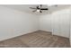 Bright bedroom with carpet, neutral walls, and a sliding-door closet for ample storage at 12207 N Escobar Way, Phoenix, AZ 85022
