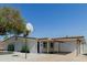 Charming single-story home featuring a basketball hoop, carport, and freshly painted exterior at 12207 N Escobar Way, Phoenix, AZ 85022