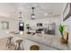 The kitchen includes a large island, stainless steel appliances, and updated fixtures for cooking and entertaining at 12207 N Escobar Way, Phoenix, AZ 85022