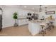 The kitchen offers stainless steel appliances, granite countertops, and modern finishes for cooking at 12207 N Escobar Way, Phoenix, AZ 85022