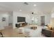 Bright living room featuring modern furnishings and neutral decor, with sliding doors to the back patio at 12207 N Escobar Way, Phoenix, AZ 85022