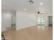 Bright and airy living room with tile floors, recessed lighting, and a sliding glass door to the backyard at 12207 N Escobar Way, Phoenix, AZ 85022