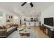 Spacious living room with open floor plan connecting to modern kitchen, perfect for entertaining at 12207 N Escobar Way, Phoenix, AZ 85022