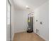Utility room with tile floors and a modern water heater at 12207 N Escobar Way, Phoenix, AZ 85022