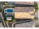Birds-eye-view of a home with dark roof tiles, backyard pool, shed, pergola, and outdoor seating at 12924 W Caraveo Pl, Peoria, AZ 85383