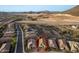 Scenic aerial view of a home nestled in a vibrant community with mountain views at 12924 W Caraveo Pl, Peoria, AZ 85383