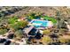 Aerial view of community pool and amenities with open green space and walking trails at 12924 W Caraveo Pl, Peoria, AZ 85383