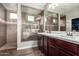 Bathroom with a walk-in shower, a large vanity and modern fixtures at 12924 W Caraveo Pl, Peoria, AZ 85383