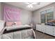 Bright bedroom featuring a ceiling fan and a well-lit dressing area at 12924 W Caraveo Pl, Peoria, AZ 85383