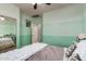 Comfortable bedroom with two-tone paint and view into another bedroom at 12924 W Caraveo Pl, Peoria, AZ 85383