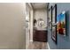 Inviting entryway featuring wood-look tile flooring and stylish decor at 12924 W Caraveo Pl, Peoria, AZ 85383