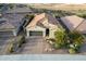 Aerial view of a single-Gathering home featuring desert landscaping, a tile roof and a brick driveway at 12924 W Caraveo Pl, Peoria, AZ 85383