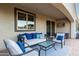 Comfortable outdoor living area with plush seating and string lights for a relaxing ambiance at 12924 W Caraveo Pl, Peoria, AZ 85383
