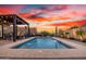 Stunning backyard with a sparkling pool, fountains, and mountain views at 12924 W Caraveo Pl, Peoria, AZ 85383