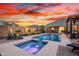 Stunning pool and spa featuring water fountains and a spacious patio, perfect for outdoor gatherings at 12924 W Caraveo Pl, Peoria, AZ 85383