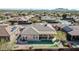 Aerial view of property showcasing beautiful backyard with artificial turf and covered patio at 1320 W Whitman Dr, Anthem, AZ 85086