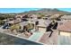Overhead view of home showcasing driveway, desert landscaping and a great neighborhood at 1320 W Whitman Dr, Anthem, AZ 85086