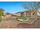Beautiful backyard featuring gravel, artificial turf, and a covered patio perfect for outdoor living at 1320 W Whitman Dr, Anthem, AZ 85086