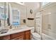 Bathroom with a single sink vanity and a shower/tub combination with a curtain at 1320 W Whitman Dr, Anthem, AZ 85086