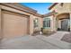 Home featuring two car garage and desert landscaping at 1320 W Whitman Dr, Anthem, AZ 85086