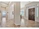 A welcoming foyer featuring tile floors, neutral paint, and natural light at 1320 W Whitman Dr, Anthem, AZ 85086