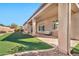 Covered patio with decorative brick, artificial turf and desert landscaping at 1320 W Whitman Dr, Anthem, AZ 85086