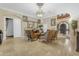 Comfortable living room featuring tile flooring, a fireplace, and elegant furnishings at 13221 N 17Th Pl, Phoenix, AZ 85022