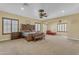 Expansive main bedroom features ample space, plantation shutters, and a sophisticated ceiling fan at 13221 N 17Th Pl, Phoenix, AZ 85022