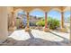 Back patio showcasing the beautiful rock water feature and desert landscaping at 13221 N 17Th Pl, Phoenix, AZ 85022