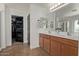 Spacious bathroom with double sinks, vanity, and a walk-in closet for ample storage at 1329 W Crape Rd, Queen Creek, AZ 85140