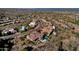 Overhead shot showcasing a desert home community with beautiful tile roofs and a shared golf course at 13827 N Sunset Dr, Fountain Hills, AZ 85268