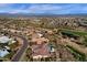 Desert community living with a home and pool area, rolling mountains, and a nearby green golf course at 13827 N Sunset Dr, Fountain Hills, AZ 85268