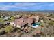 Backyard oasis with a pool, covered patio, desert landscaping, and mountain views at 13827 N Sunset Dr, Fountain Hills, AZ 85268