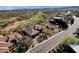 Aerial view of a desert home next to a golf course at 13827 N Sunset Dr, Fountain Hills, AZ 85268
